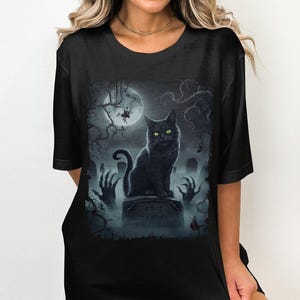 Black Cat T-Shirt, Witchy Night Design Tee, Spooky Cat and Graveyard, Magical Cat with Glowing Eyes, Halloween Gift for Cat Lovers