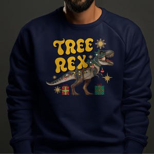 Funny Christmas Dino Tee, Dinosaur Holiday T-Shirt, TREX Gift Idea, Xmas Tree Rex Shirt, Festive Dinosaur Top, Holiday Graphic Tee