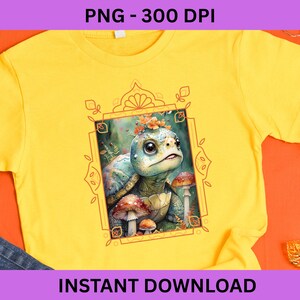 May include: Yellow t-shirt featuring a watercolor illustration of a turtle with mushrooms and flowers within a decorative frame. The text "PNG - 300 DPI" is at the top, and "INSTANT DOWNLOAD" is at the bottom.
