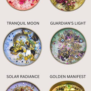 May include: Six candles with different themes and ingredients. The candles are in glass jars with gold lids. The themes are Venus Love, Mystic Vision, Tranquil Moon, Guardian's Light, Solar Radiance, and Golden Manifest.