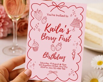 May include: A pink invitation card with a red border and text that reads "Kaila's Berry First Birthday." The card features illustrations of strawberries, a cupcake, a cake, and other decorative elements. The invitation includes the date, time, and RSVP information.