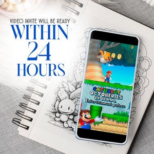 May include: A smartphone displays a colorful video game scene with Mario. Text on the screen reads "SATURDAY OCTOBER 15 04:00 PM Entertainment palace." The image is on a spiral-bound notebook with the text "VIDEO INVITE WILL BE READY WITHIN 24 HOURS."