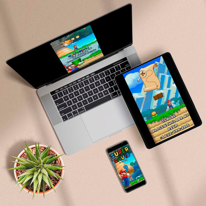 May include: A laptop, tablet, and smartphone display a colorful video game scene featuring a character. The tablet shows a treasure map and the text "75 PARK PLACE 6TH FLOOR NY RSVP +1 212-744-8000". The phone says "SUPER DAVID 9th Birthday". A succulent plant sits nearby.