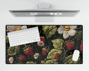 May include: A black and green mouse pad with a floral design featuring embroidered strawberries and flowers. A white keyboard and mouse are on the pad.