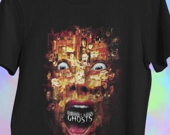 Puede incluir: Camiseta negra con un diseño gráfico de terror. El diseño presenta una cara gritando compuesta por varias imágenes, con el texto "13 Ghosts" visible en la boca abierta. Los ojos están muy abiertos.