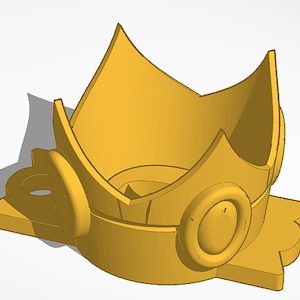 May include: A 3D-rendered golden crown with a star-shaped base. The crown features a series of upward-pointing peaks and circular embellishments. The design is symmetrical and appears to be a digital model.