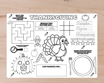 May include: A white Thanksgiving placemat with black line drawings. Features a turkey, pumpkin, maze, and fill-in-the-blank prompts. Includes the text "Thanksgiving", "Would you rather eat...", and "I am thankful for..."