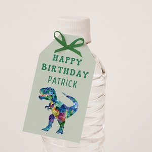 May include: A green and white gift tag with a colourful dinosaur illustration and the text "Happy Birthday Patrick".