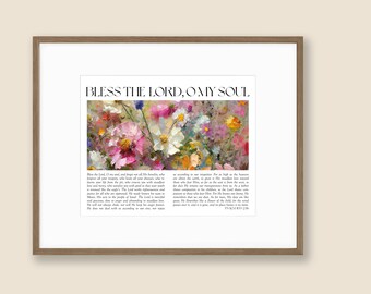 May include: A framed art print featuring a floral painting with pink, white, yellow, and blue flowers. The text "BLESS THE LORD, O MY SOUL" is at the top, with scripture below. The frame is a light brown color.