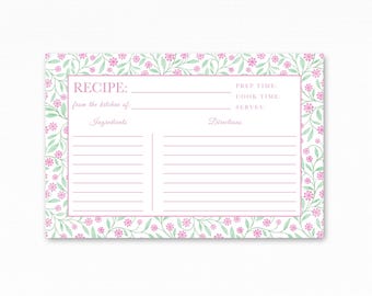 May include: A rectangular recipe card featuring a border of pink flowers and green leaves on a white background. The card includes printed text for RECIPE, PREP TIME, COOK TIME, SERVES, from the kitchen of, Ingredients, and Directions with lines.