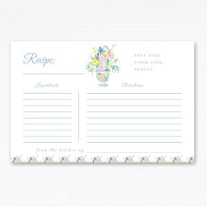 May include: A blank recipe card with a floral design. The card has sections for ingredients, directions, prep time, cook time, and serves. The text "Recipe:" and "from the kitchen of:" are printed on the card.