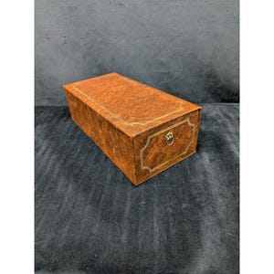 May include: A set of three ceramic mugs with a speckled, matte finish. The mugs are in shades of cream, light gray, and dark gray. Each mug has a simple, minimalist design, perfect for coffee or tea.