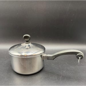 May include: A set of three ceramic mugs with a speckled, matte finish. The mugs are in shades of cream, light gray, and dark gray. Each mug has a simple, minimalist design, perfect for coffee or tea.