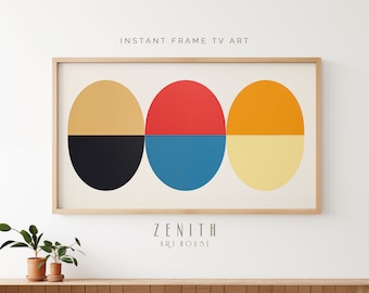 May include: Abstract art print with three overlapping circles in shades of yellow, orange, red, blue, and black. The print is framed in a light wood frame and has the text "ZENITH ART HOUSE" below the circles.