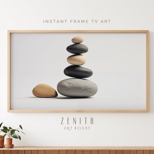 Puede incluir: Una impresión enmarcada de una pila de piedras grises y beige sobre un fondo blanco. La impresión se titula "Zenith Art House".