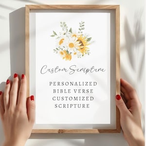 May include: A framed print featuring a watercolour illustration of sunflowers and daisies. The text reads "Custom Scripture", "Personalized Bible Verse", "Customized Scripture".