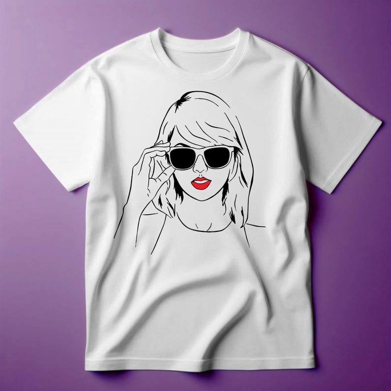 May include: White t-shirt with a black and white line drawing of a woman wearing sunglasses and red lipstick.