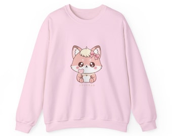 May include: A light pink sweatshirt featuring a cartoon fox with a pink bow and heart-shaped lollipop. The fox has brown ears and a light pink face. The Japanese text "コケットキスム" is below the fox.