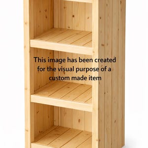 May include: A light-coloured wooden cabinet with three shelves. The cabinet is made of vertical wooden planks and has a rectangular shape. The text on the cabinet says: "This image has been created for the visual purpose of a custom made item."
