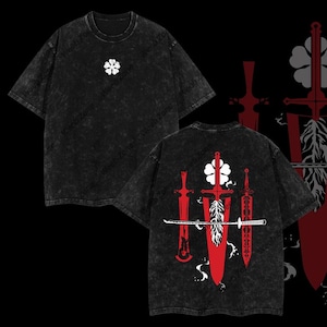 May include: Black t-shirt with a white clover on the front and a design of four swords with a red clover on the back.