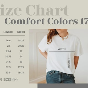 May include: A white Comfort Colors 1717 t-shirt with a size chart showing measurements in inches. The chart includes sizes S to 4XL, with lengths from 67.6 to 85.1 cm and widths from 46.4 to 75.6 cm.