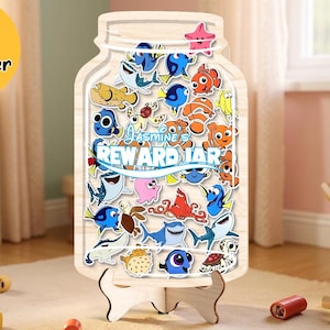 May include: Wooden reward jar-shaped sign with a collection of cartoon fish stickers. The sign reads "Jasmine's Reward Jar" and is supported by a wooden stand. A yellow circle with "SIZE L Best Seller" is in the upper left.