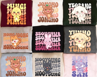 May include: Nine colourful sweatshirts featuring cartoon animal graphics and names. The sweatshirts are in various colours, including burgundy, white, and black. Each sweatshirt has a different animal and name in a retro font.