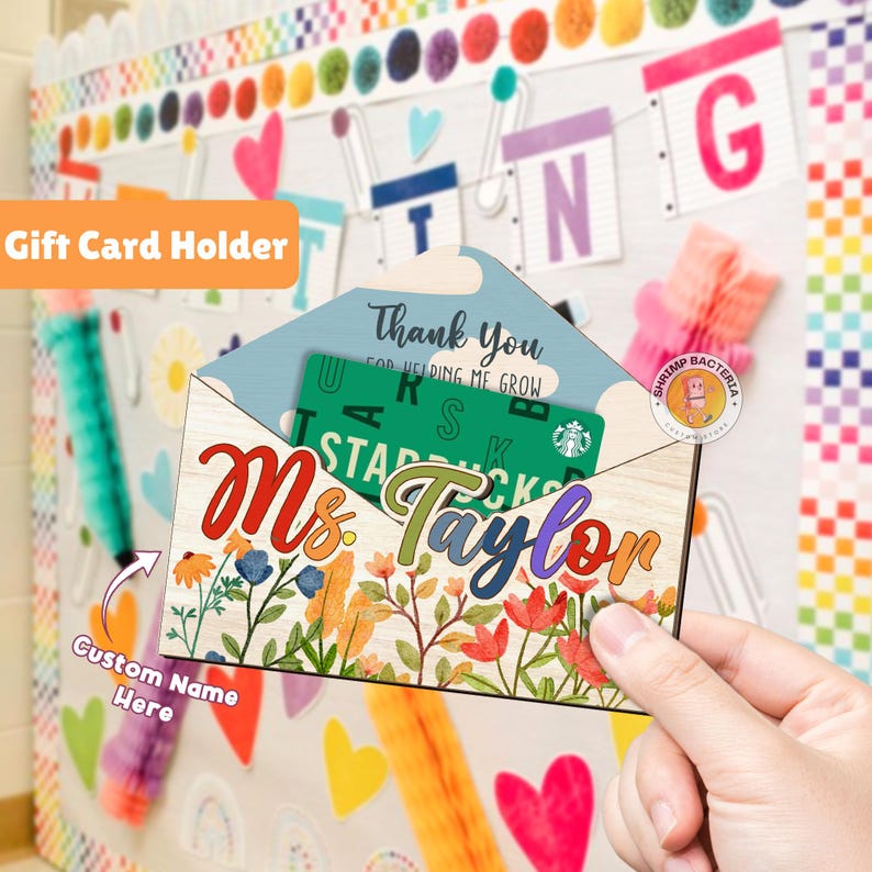 May include: A colorful gift card holder with a floral design and the text "Ms. Taylor" and "Thank You for Helping Me Grow".