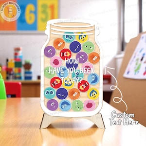 May include: Wooden jar-shaped sign with the text "How Have You Been Today?" and various emotion faces. The sign is on a wooden stand, with a custom text area. The background includes colorful toys and numbers.