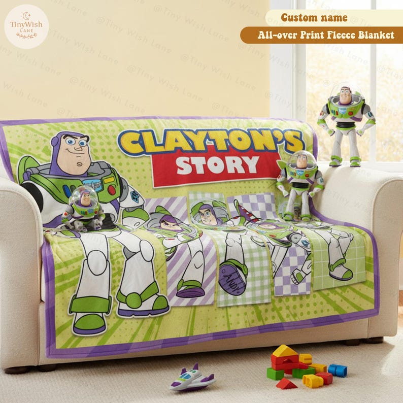 May include: A green, white, and purple fleece blanket with a Buzz Lightyear design, featuring the text "CLAYTON'S STORY." The blanket is draped over a sofa, with Buzz Lightyear figurines and toys nearby. The blanket is approximately 60 inches wide.
