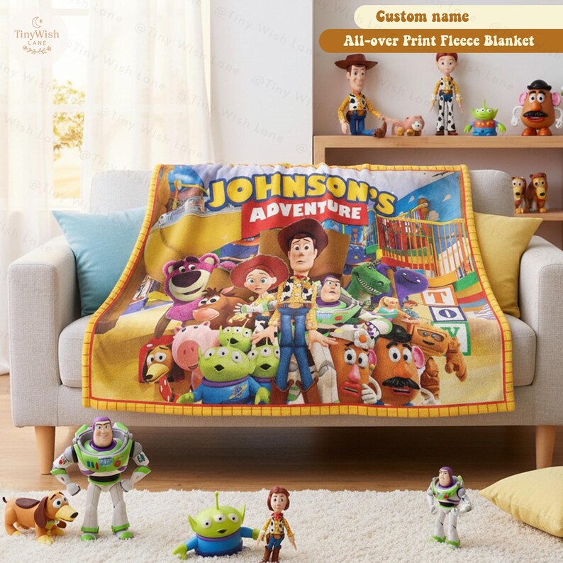 May include: A fleece blanket featuring a colorful graphic print of various animated characters from the Toy Story franchise, with the text JOHNSON'S ADVENTURE prominently displayed in yellow and white letters across the top center.