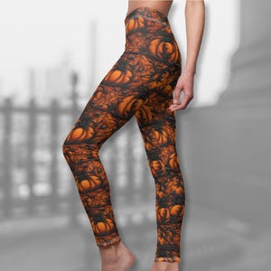 May include: Orange and black leggings with a repeating pattern of pumpkins. The leggings are form-fitting and have a high waist.
