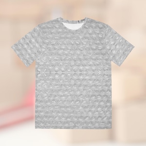 May include: A gray t-shirt with a bubble wrap pattern.