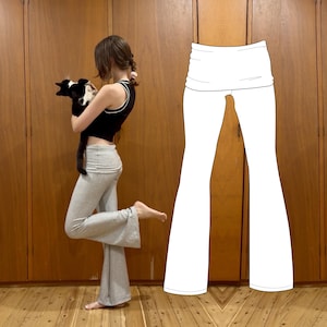 May include: Light gray flare pants featuring a wide, fold-over waistband. The pants have a fitted silhouette through the hips and thighs, transitioning into a flared leg opening. A white line drawing illustration of the same pants is shown alongside.