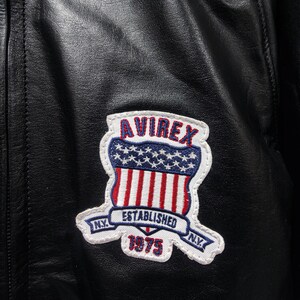 May include: A set of three ceramic mugs with a speckled, matte finish. The mugs are in shades of cream, light gray, and dark gray. Each mug has a simple, minimalist design and a rounded handle. The mugs are stacked on top of each other.