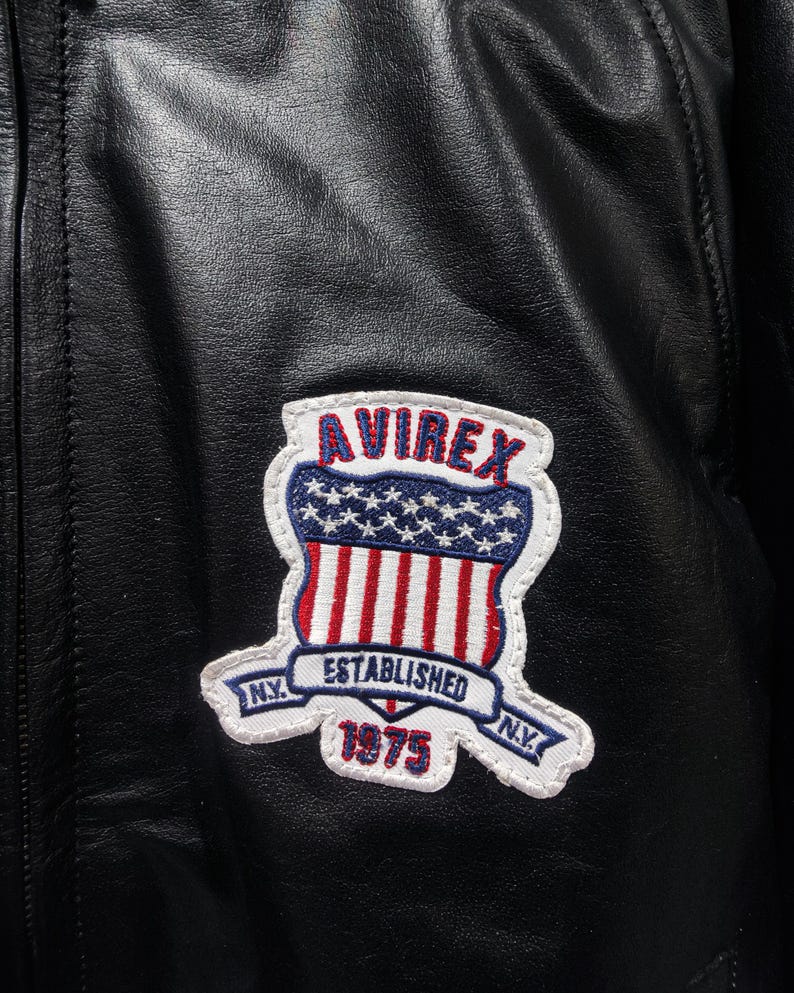 May include: A set of three ceramic mugs with a speckled, matte finish. The mugs are in shades of cream, light gray, and dark gray. Each mug has a simple, minimalist design and a rounded handle. The mugs are stacked on top of each other.