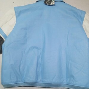 May include: Light blue varsity jacket with white sleeves and a striped hem. The jacket has a collar and a tag attached. The sleeves are white with a black stripe. The jacket is made of leather.