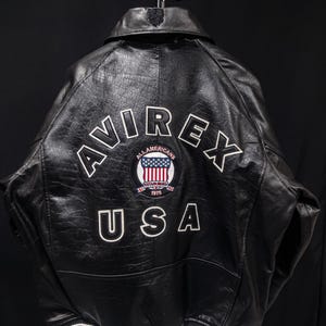 Avirex Established 1975 Black Leather Varsity Jacket – Striped Ribbed Trim Zip Up Bomber Jacket image 2