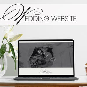 May include: A laptop screen shows a wedding website design, with the words "Wedding Website" at the top. The website features a grayscale image of a couple and the names "Olivia J. Kevin." White flowers in a vase are on the left.