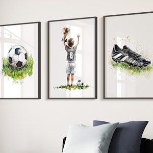 May include: Three framed watercolour paintings depicting a football player holding a trophy, a football, and a football boot. The player is wearing a white jersey with the number 8 and the name "Harry" on the back.