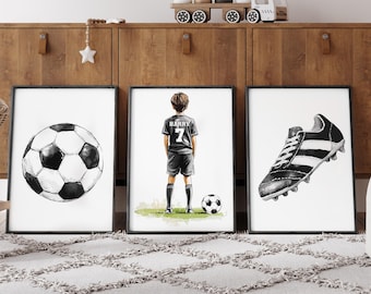 May include: Three framed prints featuring soccer themes. One print shows a black and white soccer ball, another depicts a soccer player in a black uniform, and the third shows a black and white soccer cleat.