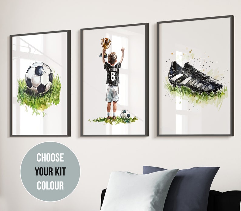 May include: Three framed watercolour illustrations of a football, a player holding a trophy, and a football boot. The player is wearing a black and white football kit with the name "Harry" and the number "8" on the back. The illustrations are set against a white background.