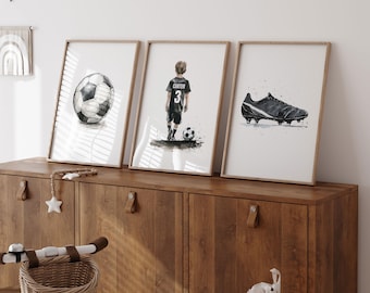 May include: Three framed prints with watercolor illustrations of a soccer ball, a soccer player wearing a jersey with the name "Carter" and the number "3", and a black soccer cleat.