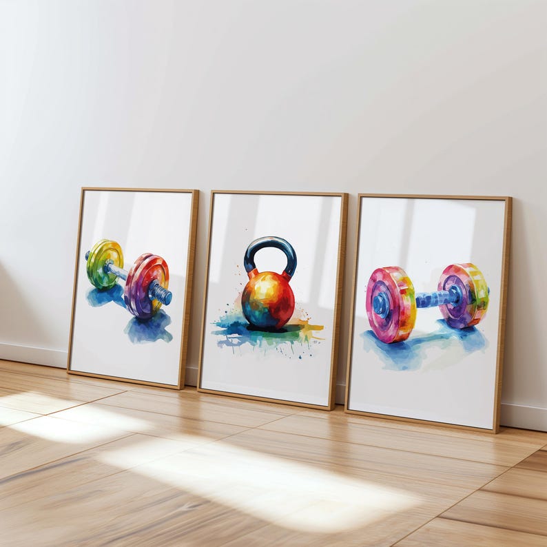 May include: Three framed watercolor paintings of colorful weightlifting equipment. The first painting shows a dumbbell with a blue, green, yellow, and red color scheme. The second painting shows a kettlebell with a red, orange, yellow, and blue color scheme. The third painting shows a dumbbell with a blue, green, yellow, and red color scheme.
