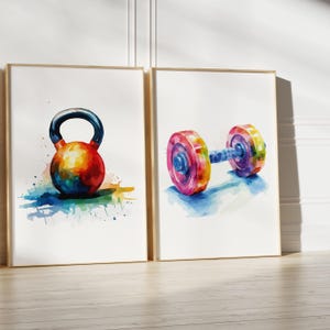 May include: Two watercolor paintings of colorful weights. The first painting shows a kettlebell with a rainbow color scheme. The second painting shows a dumbbell with a rainbow color scheme.