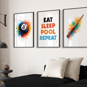 May include: Three framed prints for wall art. One shows a colourful watercolour eight ball. Another says "EAT SLEEP POOL REPEAT" in bold letters. The third shows a pool cue with colourful paint splatters.