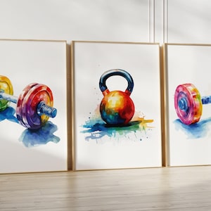 May include: Three framed watercolor paintings of gym equipment. The first painting shows a colorful barbell with weights. The second painting shows a colorful kettlebell. The third painting shows a colorful barbell with weights.