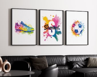 May include: Three framed watercolor prints with a colorful splatter background. The first print features a soccer cleat, the second print features the name "Samuel" with a large letter "S", and the third print features a soccer ball.