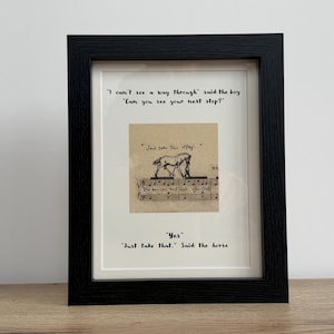May include: Black framed artwork featuring a horse illustration on vintage paper with musical notes. The text includes the phrases "I can't see a way through" and "Just take that." The frame is black.
