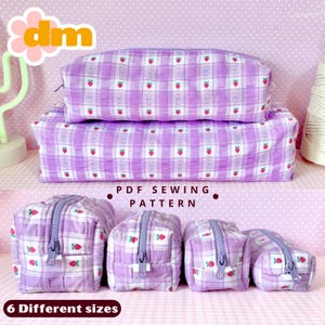 May include: A collection of purple plaid fabric pouches and pencil cases with a strawberry pattern. The image includes the text "PDF Sewing Pattern" and "6 Different sizes". The pouches have silver zippers.